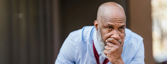 concerned office worker worrying about his future