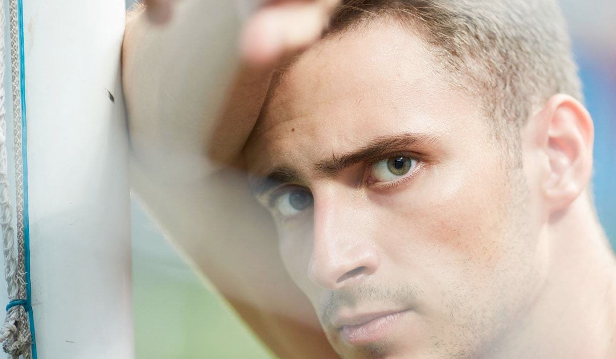 footballer-looking-stressed-on-the-pitch