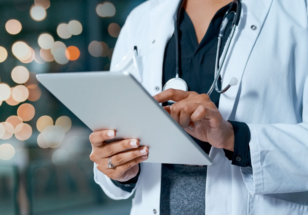 occupational health physician checking test results on a tablet