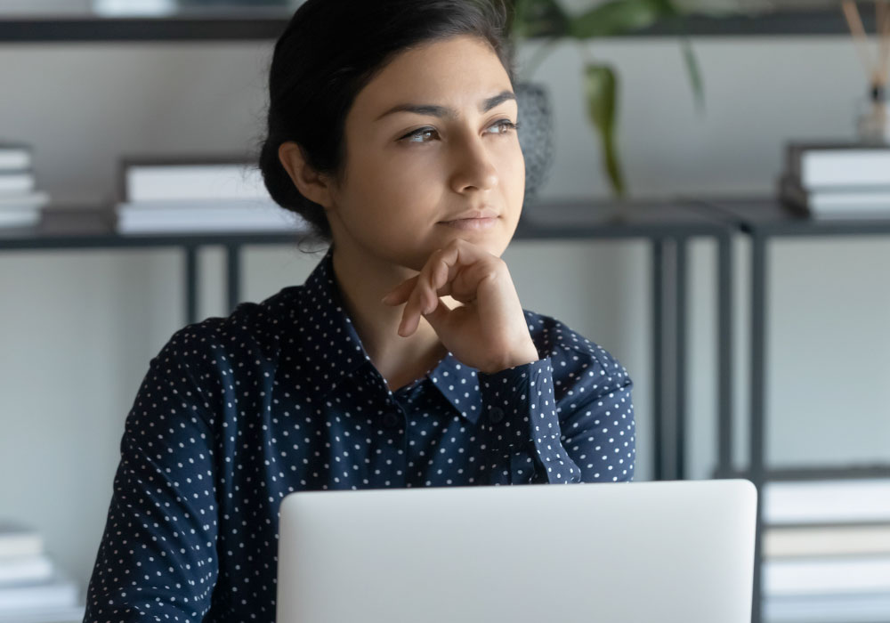 office worker with a considering expression