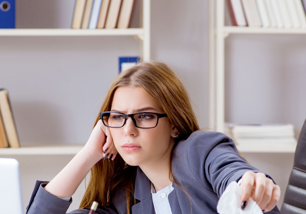 Stressed employee showing signs of presenteeism